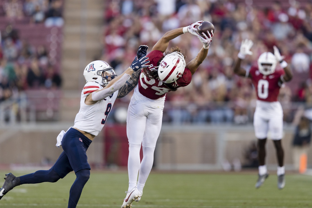 Sep 23, 2023; Stanford, California, USA; Arizona Wildcats safety Gunner Maldonado (9) defends as Stanford Cardinal wide receiver Tiger Bachmeier (24) catches a thirty-five yard pass during the third quarter at Stanford Stadium. Mandatory Credit: John Hefti-USA TODAY Sports